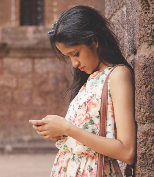 Young woman looking at phone